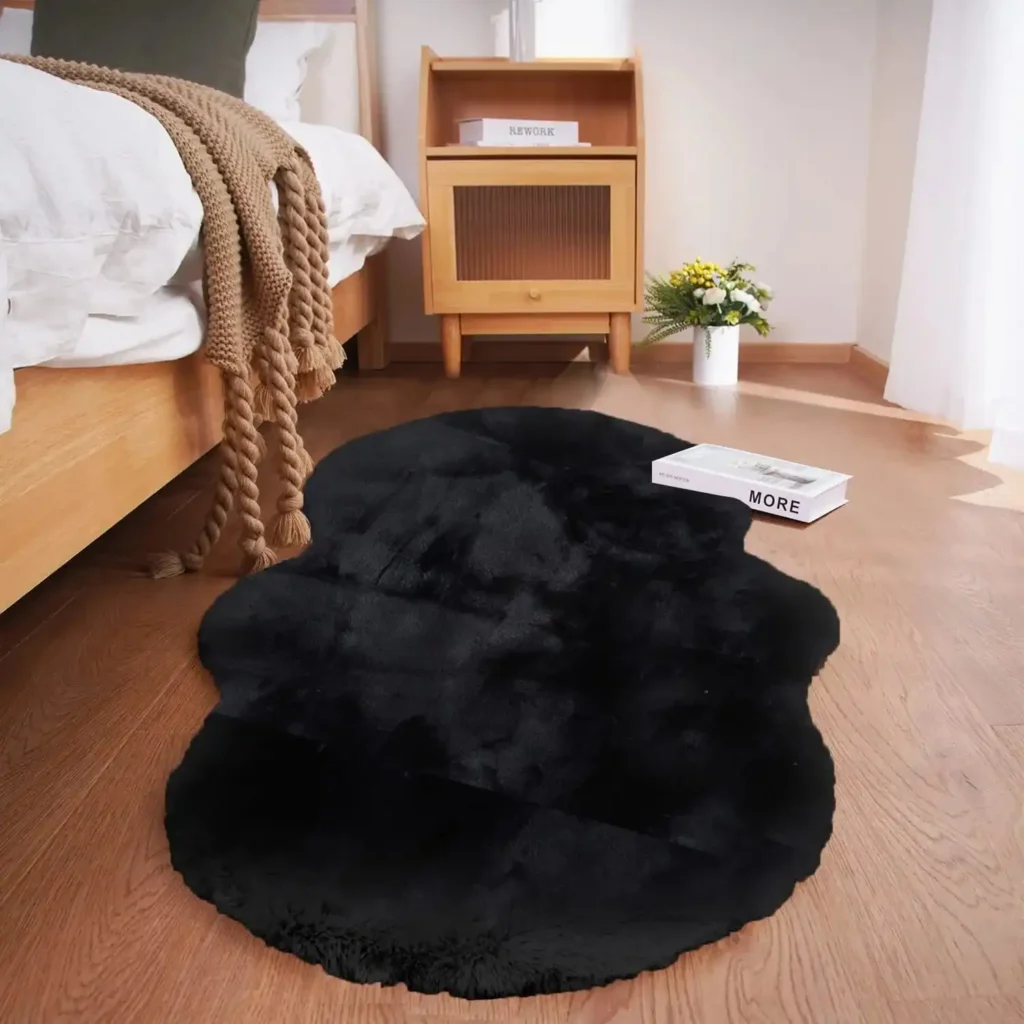 Black irregular shaped fluffy rug in modern bedroom with wooden furniture and white bedding