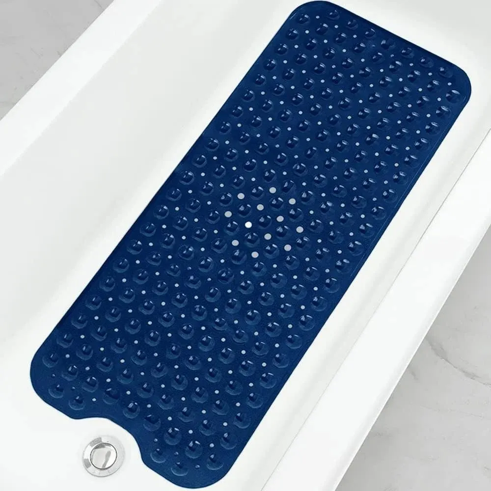 Navy blue non-slip bath mat with suction cups in white bathtub