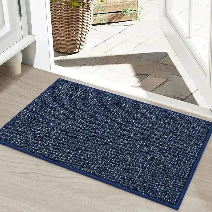 Navy blue textured entrance mat with border at doorway