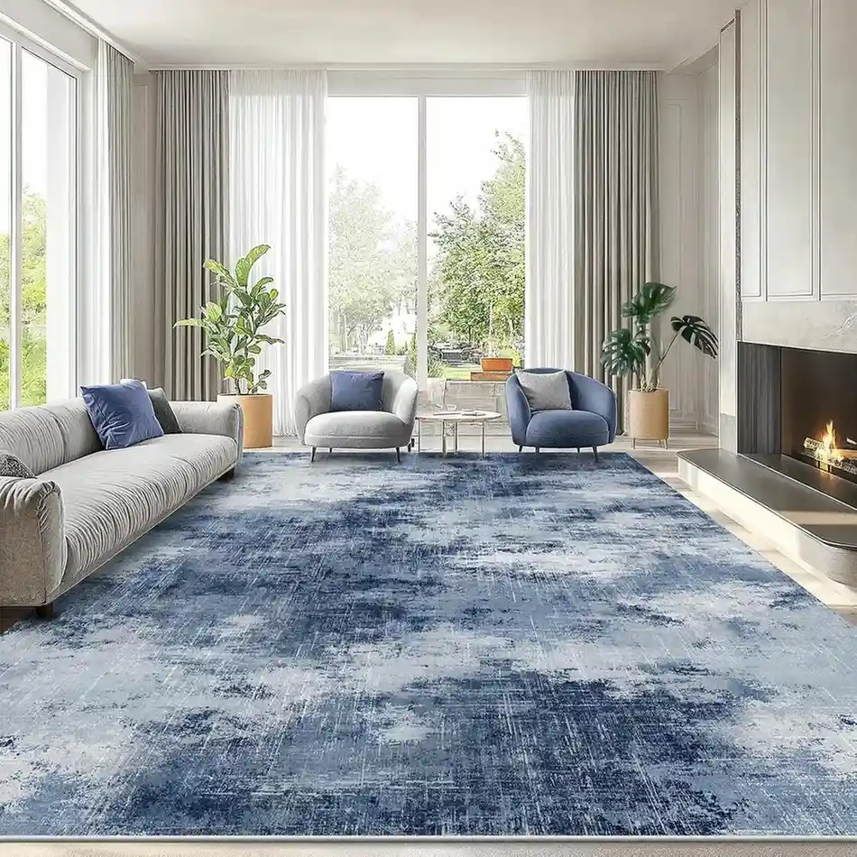 Blue and gray distressed area rug in modern living room with fireplace and contemporary furniture