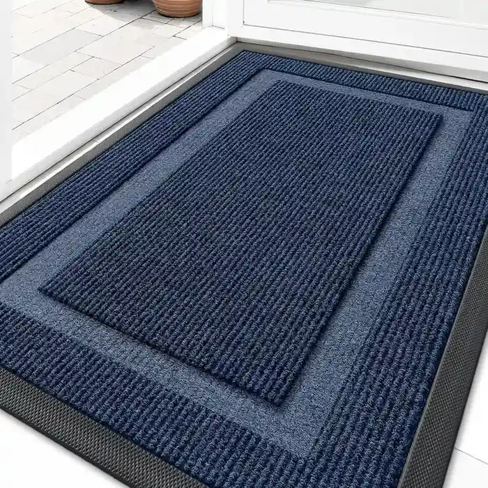 Navy blue ribbed entrance mat with layered borders at doorway