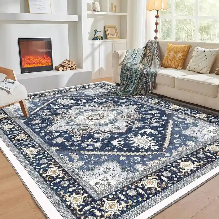 Navy blue traditional Persian area rug with intricate floral medallion pattern in bright living room