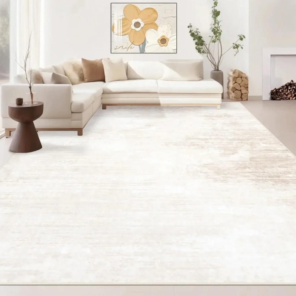 Large cream and white distressed area rug in modern living room with subtle vintage pattern.