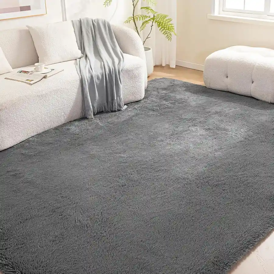 Dark grey plush shag area rug in modern living room