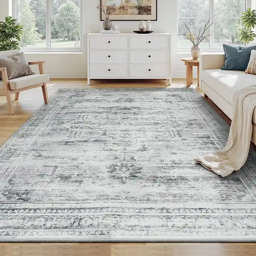Gray and white distressed vintage area rug in bright living room
