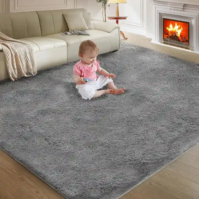 Light gray plush shag area rug in living room