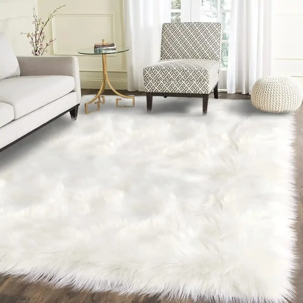 Large, plush white faux fur area rug in a bright modern living room setting.