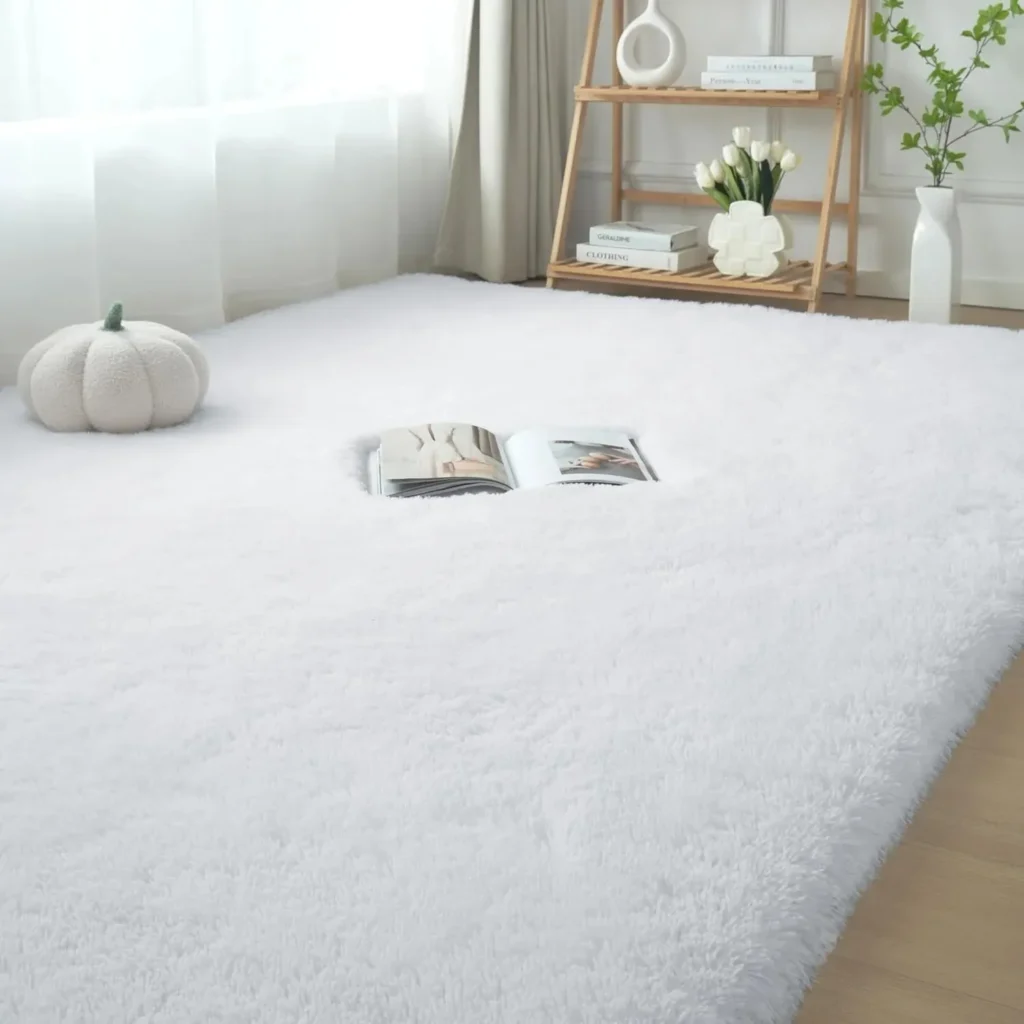 Large plush white shag area rug with ultra-soft texture in bright minimalist room.